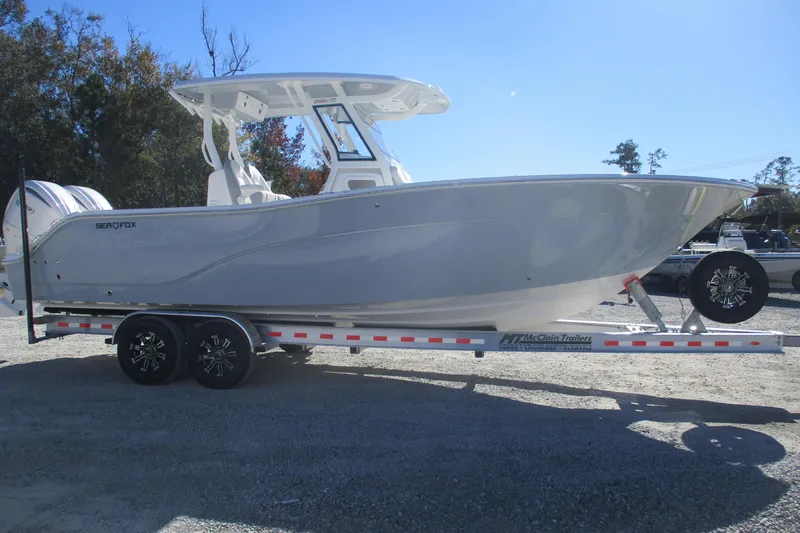 Slide: The Image of 2026 Sea Fox 288 Commander boat on trailer, side view, outdoors. - 4