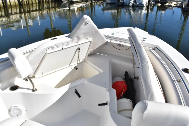 Slide: The Image of 2018 Sea Hunt Ultra 225 boat interior with open storage compartments. - 14