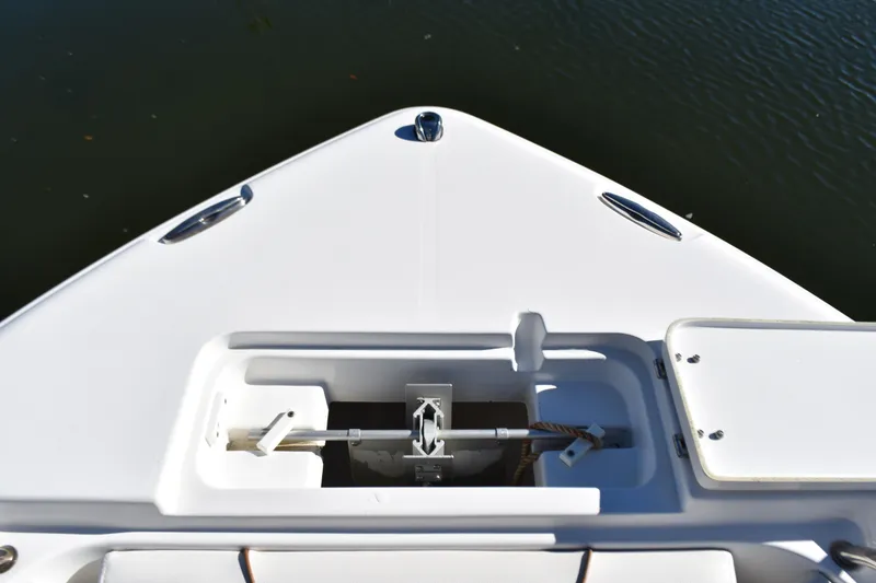Slide: The Image of Bow of 2018 Sea Hunt Ultra 225 boat with anchor storage compartment. - 16