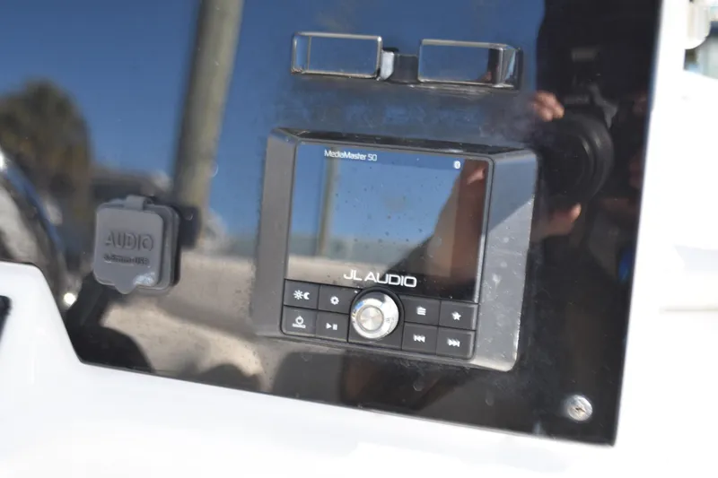 Slide: The Image of JL Audio system on 2018 Sea Hunt Ultra 225 boat dashboard. - 25
