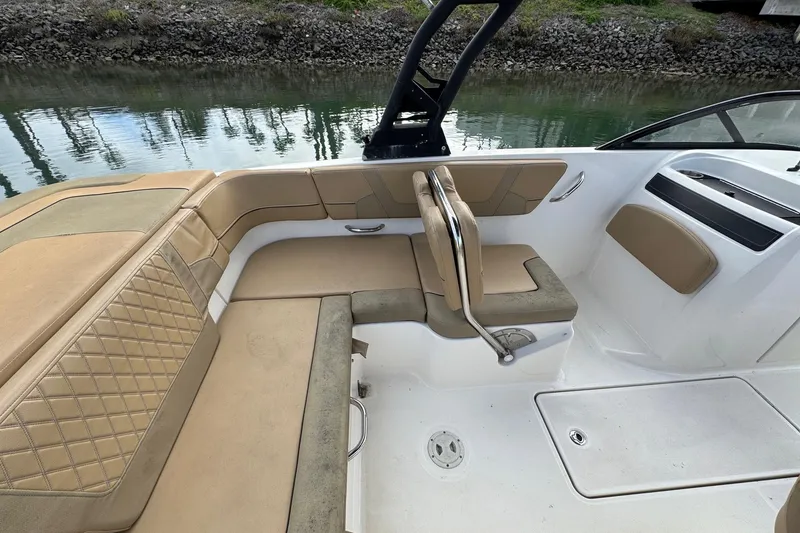 Slide: The Image of 2022 Bayliner VR6 Bowrider OB interior with beige seating and sleek design. - 17
