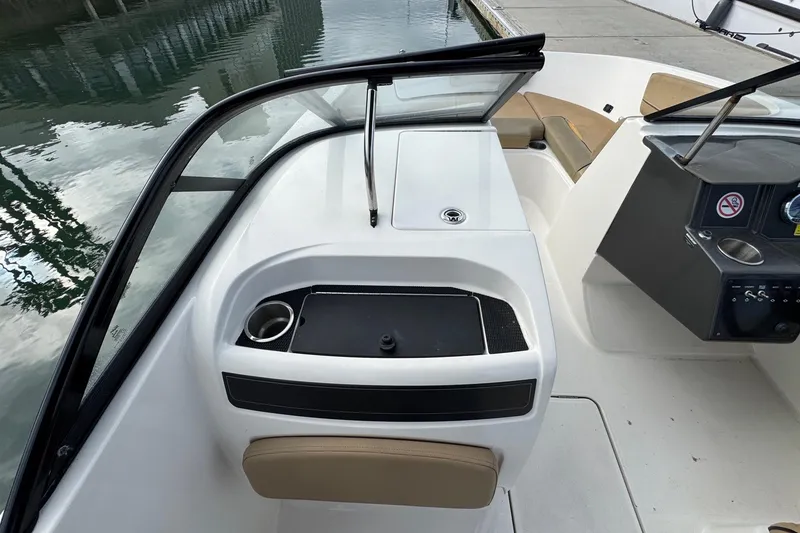 Slide: The Image of 2022 Bayliner VR6 Bowrider OB interior with seating and console details. - 28