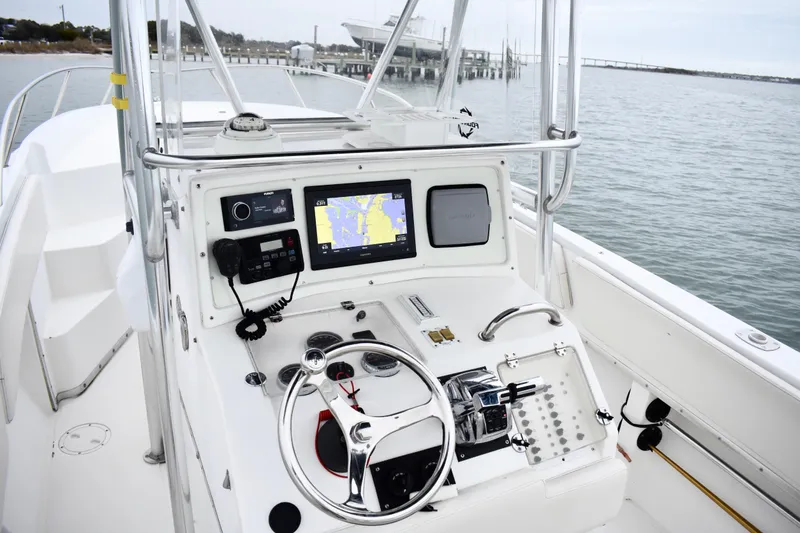 Slide: The Image of 2001 Fountain 31 Tournament Edition boat cockpit with navigation equipment and steering wheel. - 19