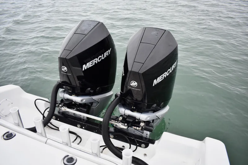 Slide: The Image of Twin Mercury outboard engines on a 2001 Fountain 31 Tournament Edition boat. - 26