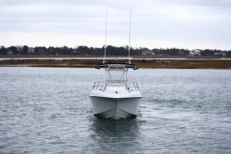 Slide: The Image of 2001 Fountain 31 Tournament Edition boat on calm water, overcast sky. - 9