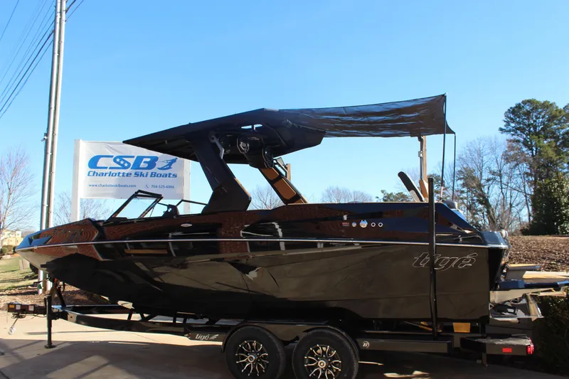 Slide: The Image of 2026 Tigé 24RZX boat on trailer at Charlotte Ski Boats dealership. - 11