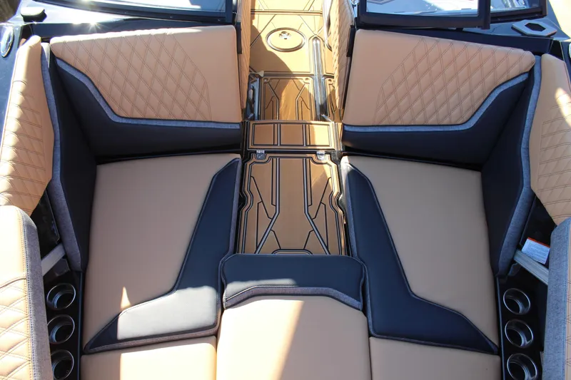 Slide: The Image of 2026 Tigé 24RZX boat interior with tan and black seating, modern design. - 20