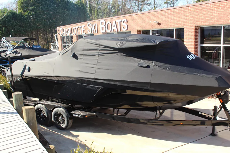 Slide: The Image of 2026 Tigé 24RZX boat covered, parked at Charlotte Ski Boats dealership. - 29
