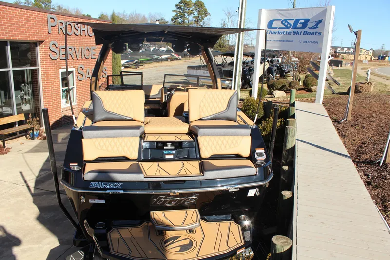 Slide: The Image of 2026 Tigé 24RZX boat displayed at Charlotte Ski Boats dealership. - 9
