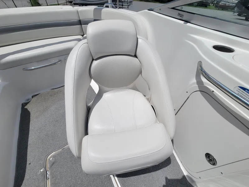Slide: The Image of 2007 Chaparral Sunesta 214 boat interior with white cushioned seating. - 15