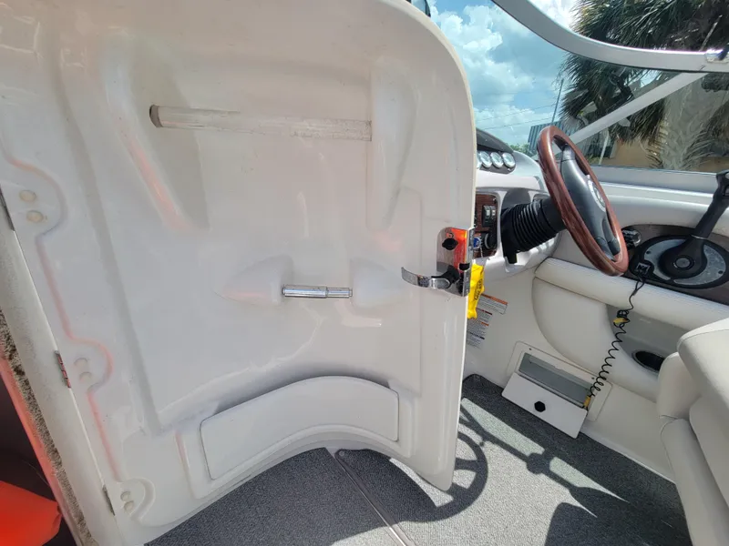 Slide: The Image of 2007 Chaparral Sunesta 214 boat interior with steering wheel and dashboard view. - 18