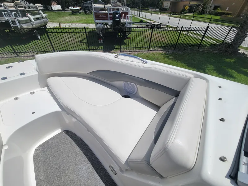 Slide: The Image of 2007 Chaparral Sunesta 214 boat interior with white cushioned seating. - 22