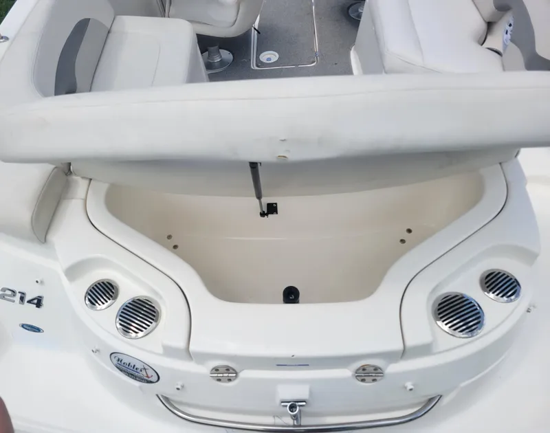 Slide: The Image of 2007 Chaparral Sunesta 214 boat interior with seating and storage compartment. - 25
