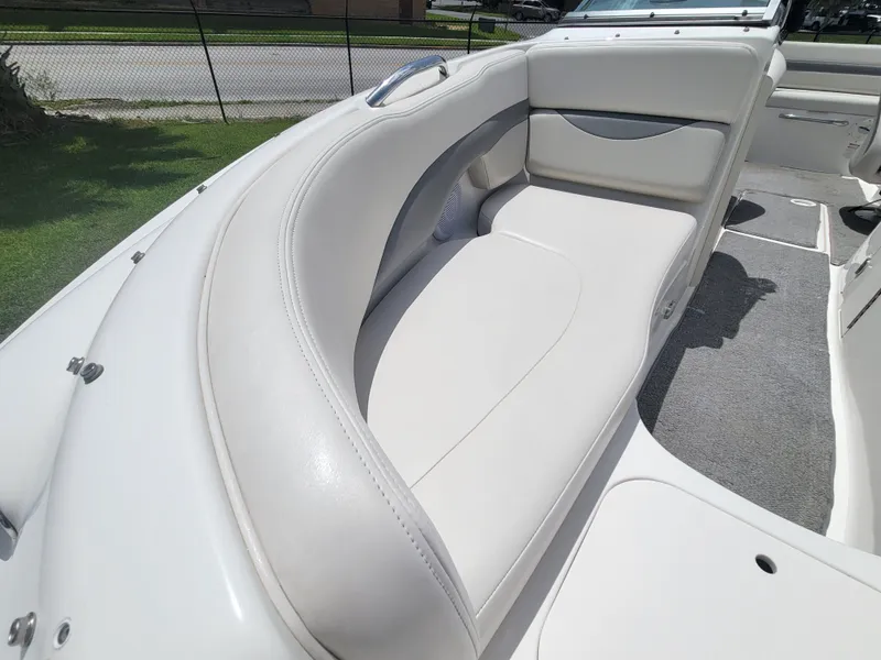 Slide: The Image of 2007 Chaparral Sunesta 214 boat interior with white seating and gray carpet. - 8