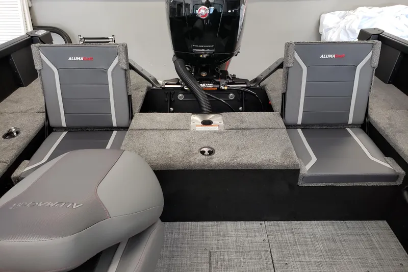 Slide: The Image of 2026 Alumacraft Competitor 175 Sport boat interior with gray seating and motor. - 10