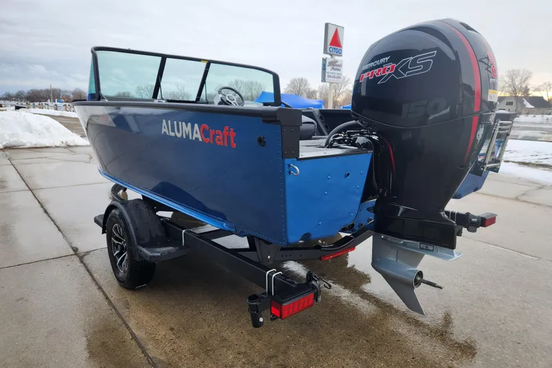 Slide: The Image of 2026 Alumacraft Competitor 175 Sport boat with Mercury Pro XS engine on trailer. - 4