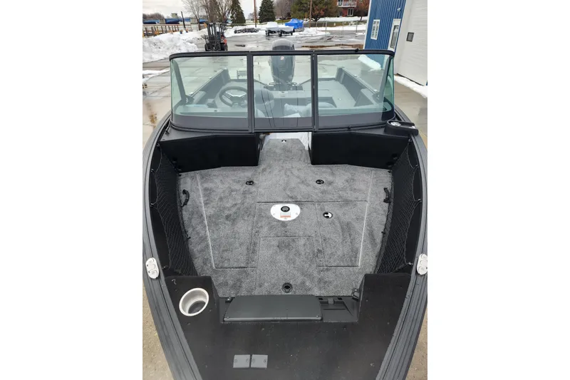 Slide: The Image of 2026 Alumacraft Competitor 175 Sport boat interior with carpeted deck and windshield. - 7