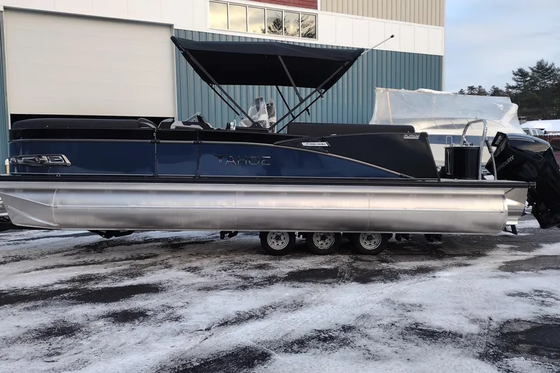 The Image of 2026 Tahoe Pontoon 25 Cascade Quad Lounge on snowy ground, showcasing sleek design. - 0