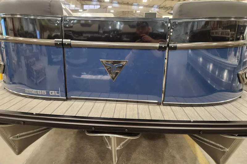 Slide: The Image of Captain's seat of 2026 Tahoe Pontoon 25 Cascade Quad Lounge, wrapped in protective plastic. - 11