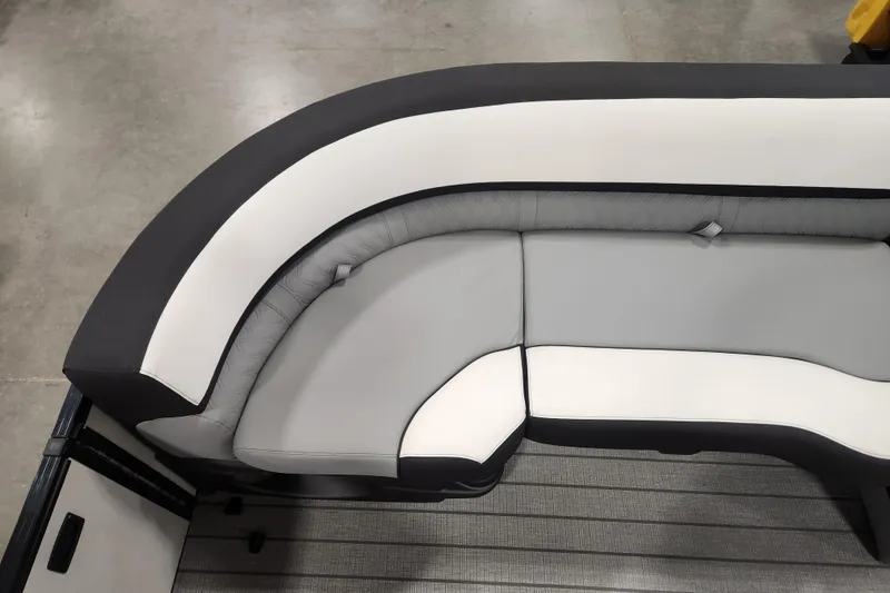 Slide: The Image of 2026 Tahoe Pontoon 25 Cascade Quad Lounge with fold-out table and cup holders. - 17