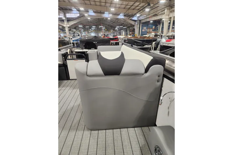 Slide: The Image of 2026 Tahoe Pontoon 25 Cascade Quad Lounge with powerful outboard motor in snowy setting. - 19