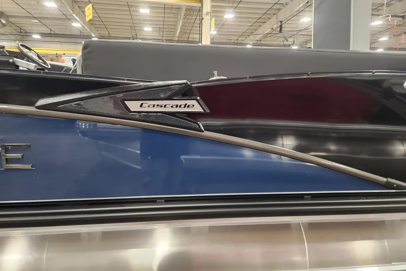 Slide: The Image of 2026 Tahoe Pontoon 25 Cascade Quad Lounge, sleek blue design, luxury seating. - 21
