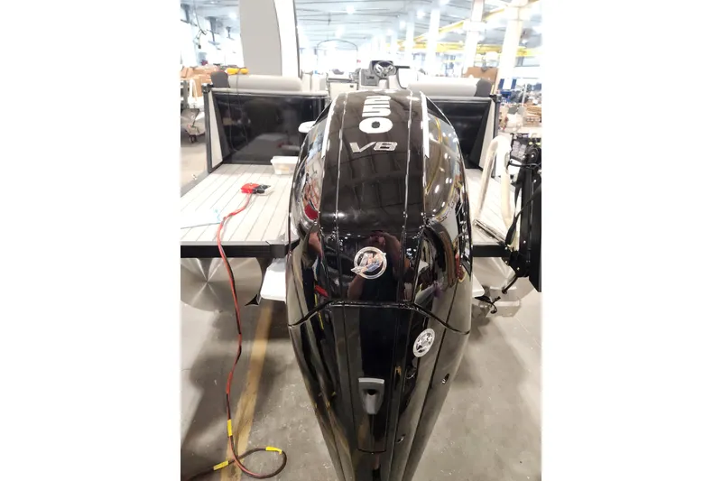 Slide: The Image of 2026 Tahoe Pontoon 25 Cascade Quad Lounge, sleek design, parked on snowy ground. - 3