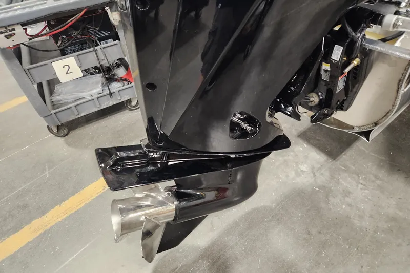 Slide: The Image of 2026 Tahoe Pontoon 25 Cascade Quad Lounge on snowy ground, featuring sleek design and canopy. - 4