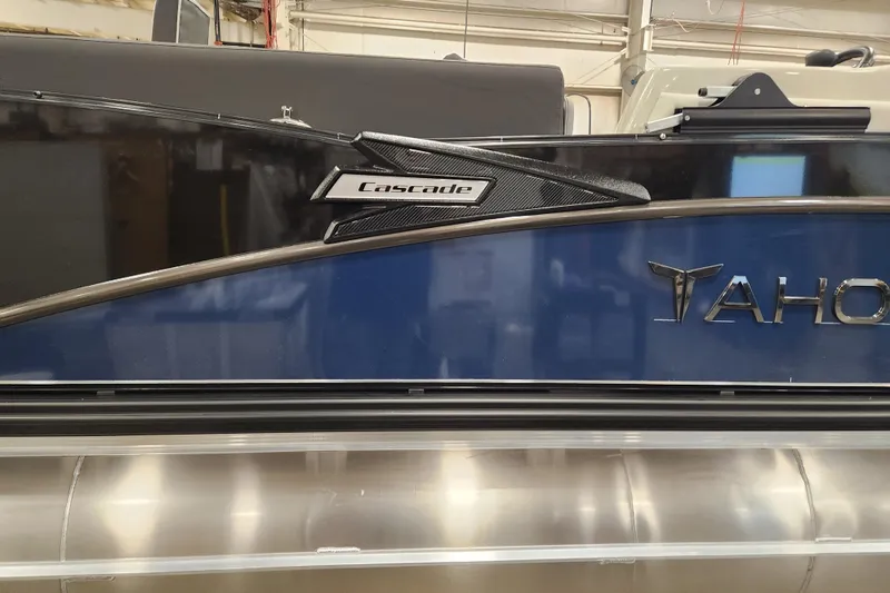 Slide: The Image of 2026 Tahoe Pontoon 25 Cascade Quad Lounge, sleek design with blue and black accents. - 44