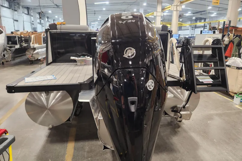 Slide: The Image of 2026 Tahoe Pontoon 25 Cascade Quad Lounge with Mercury engine, parked on snowy ground. - 5