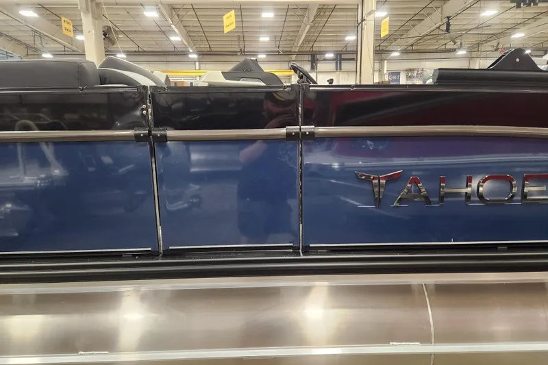 Slide: The Image of 2026 Tahoe Pontoon 25 Cascade Quad Lounge dashboard with modern controls and touchscreen display. - 9