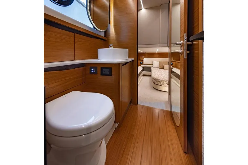 Slide: The Image of Manufacturer Provided Image: Luxurious bathroom interior of 2026 Tiara Yachts 56 LS, featuring modern fixtures and wood accents. - 16