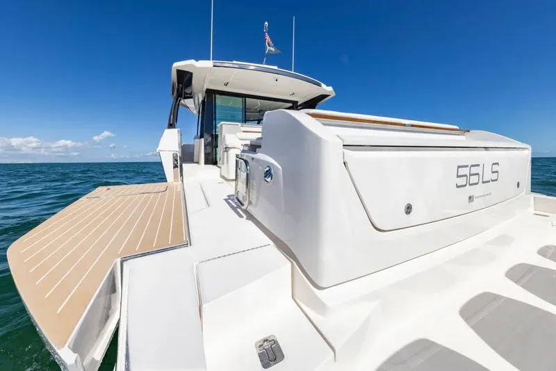 Slide: The Image of Manufacturer Provided Image: 2026 Tiara Yachts 56 LS luxury yacht on open sea, showcasing sleek design and spacious deck. - 8