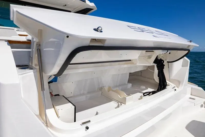 Slide: The Image of Manufacturer Provided Image: Open storage compartment on 2026 Tiara Yachts 56 LS, showcasing spacious design. - 9