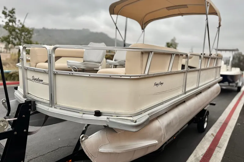 Slide: The Image of 2004 Sun Tracker Party Barge 21 pontoon boat with canopy on trailer. - 3