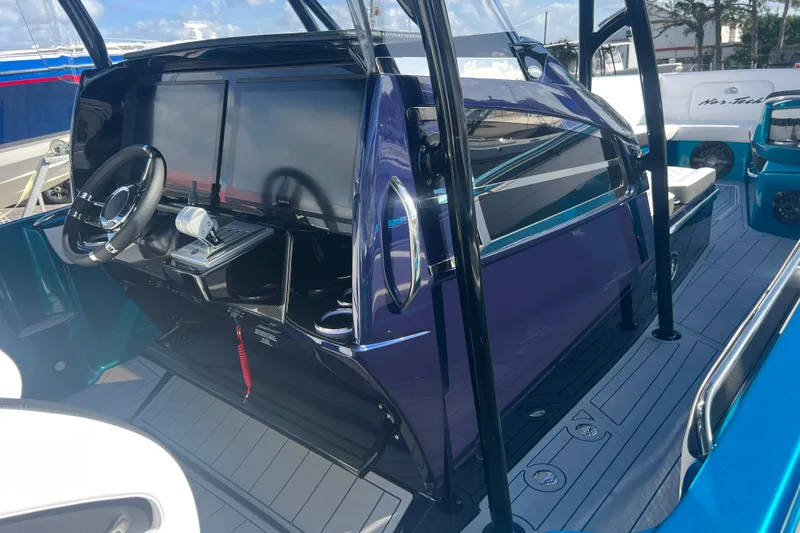 Slide: The Image of 2026 Nor-Tech 390 Sport Center Console with sleek dashboard and modern controls. - 11