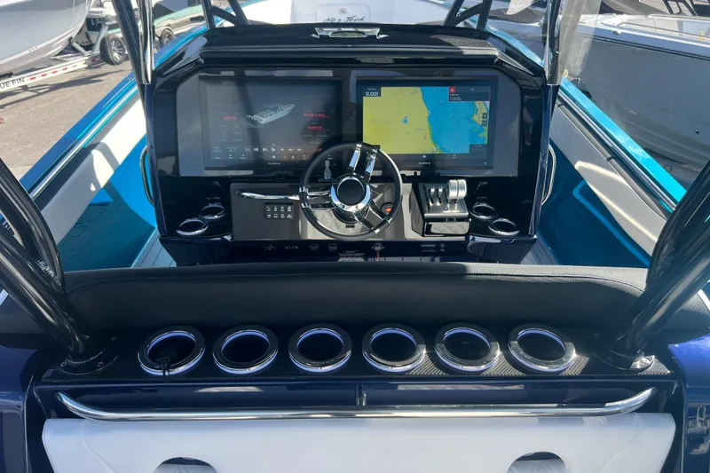 Slide: The Image of 2026 Nor-Tech 390 Sport Center Console dashboard with advanced navigation and control systems. - 13