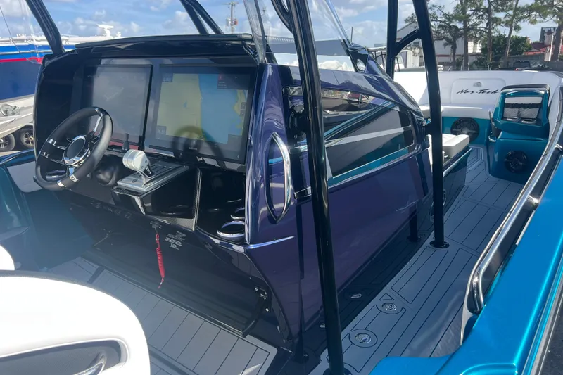 Slide: The Image of 2026 Nor-Tech 390 Sport Center Console with modern cockpit and navigation screens. - 14