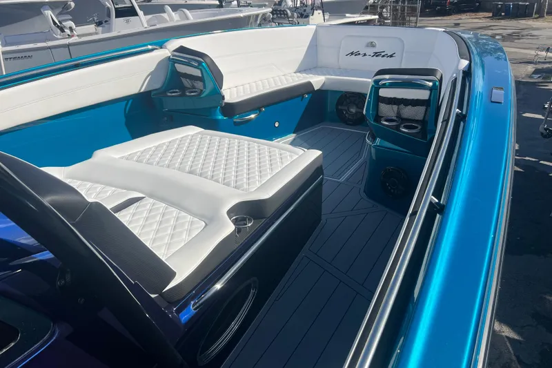 Slide: The Image of 2026 Nor-Tech 390 Sport Center Console with luxurious seating and sleek design. - 16