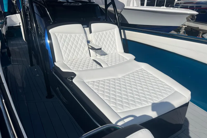 Slide: The Image of 2026 Nor-Tech 390 Sport Center Console with luxurious white seating. - 20