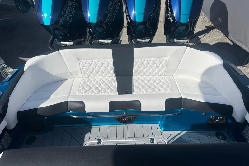 Slide: The Image of 2026 Nor-Tech 390 Sport Center Console with luxurious white seating and powerful engines. - 25
