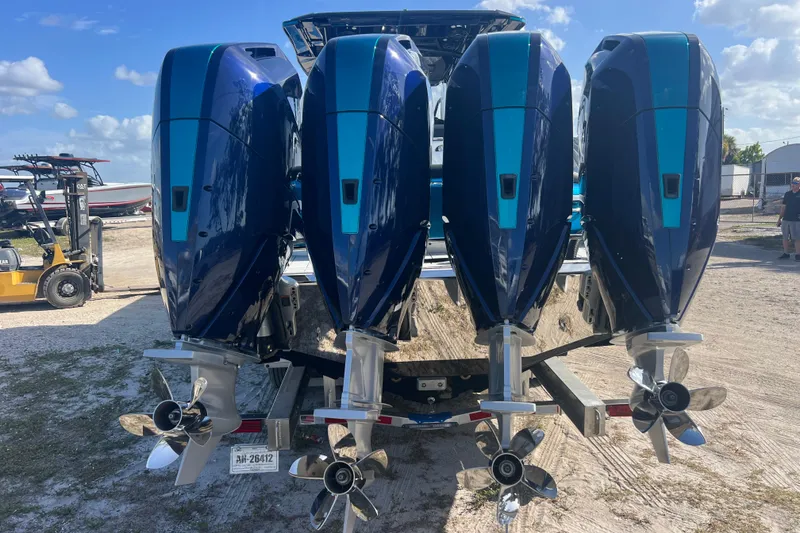 Slide: The Image of 2026 Nor-Tech 390 Sport Center Console with four powerful outboard engines. - 6