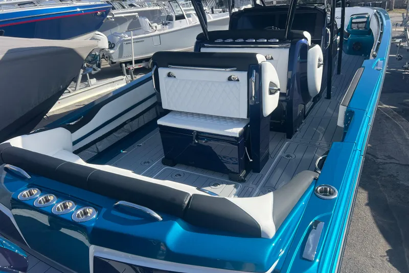 Slide: The Image of 2026 Nor-Tech 390 Sport Center Console boat with sleek seating and modern design. - 7