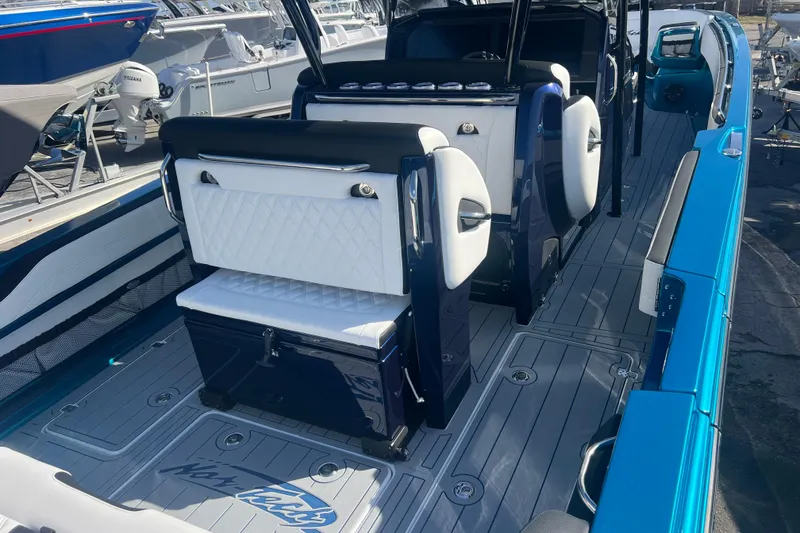 Slide: The Image of 2026 Nor-Tech 390 Sport Center Console interior with sleek seating and modern design. - 8