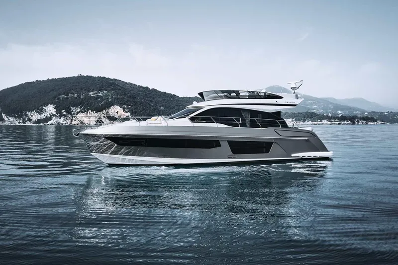 Slide: The Image of Manufacturer Provided Image: 2025 Azimut Fly 53 yacht cruising on serene waters with scenic mountain backdrop. - 0