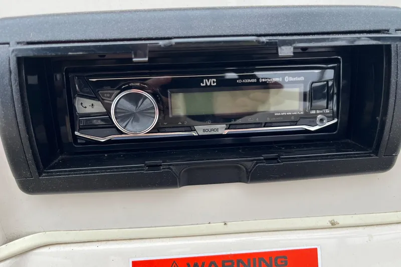 Slide: The Image of JVC KD-X33MBS Bluetooth stereo in a 2005 GEN3 LX3 22C vehicle dashboard. - 11
