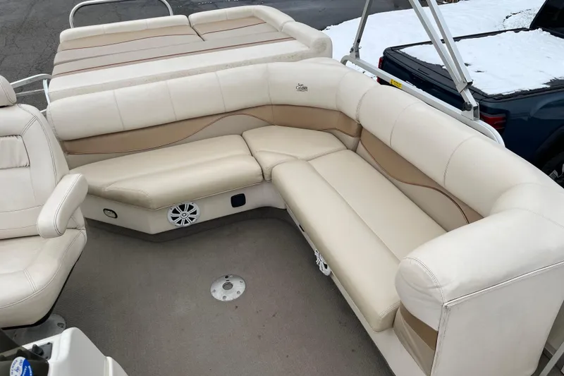 Slide: The Image of Luxurious seating on 2005 GEN3 LX3 22C boat, featuring beige upholstery and spacious layout. - 5