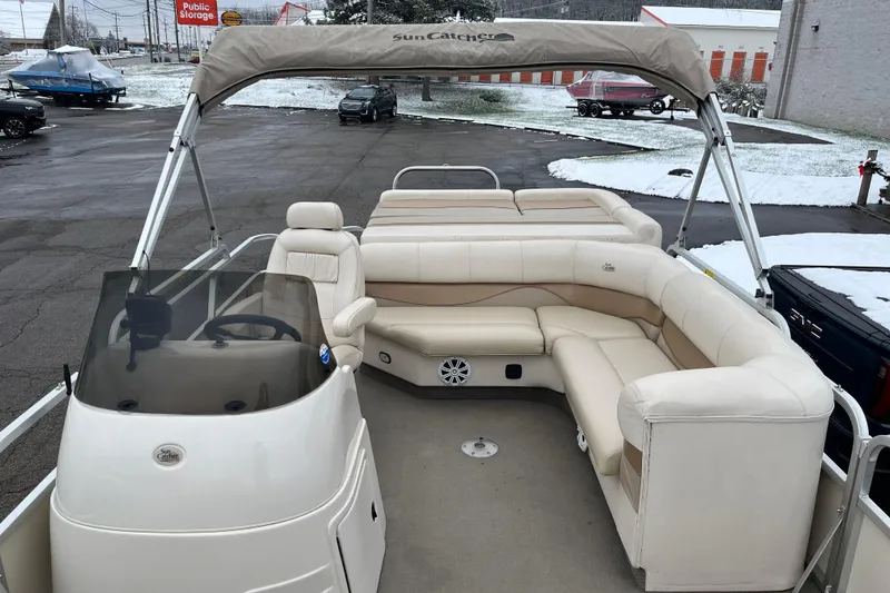 Slide: The Image of Pontoon boat with beige seating, canopy, and steering console, GEN3 LX3 22C, 2005 model. - 6