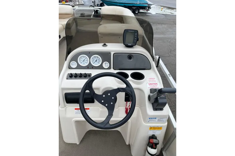 Slide: The Image of Steering console of 2005 GEN3 LX3 22C boat with gauges and controls. - 8