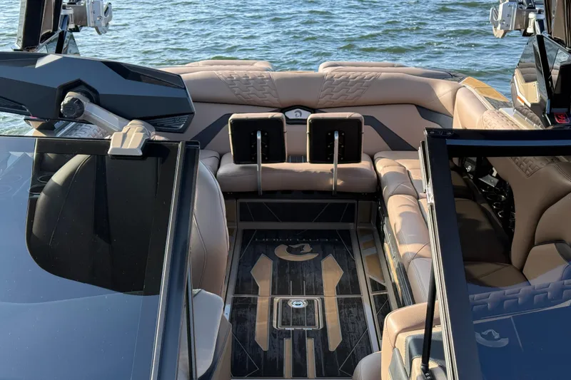 Slide: The Image of 2025 Centurion Ri245 boat interior with luxurious seating and modern design on the water. - 15